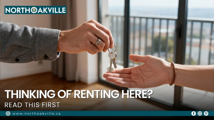 Landlord handing house keys to a new tenant inside a modern North Oakville rental apartment near a glass balcony door.
